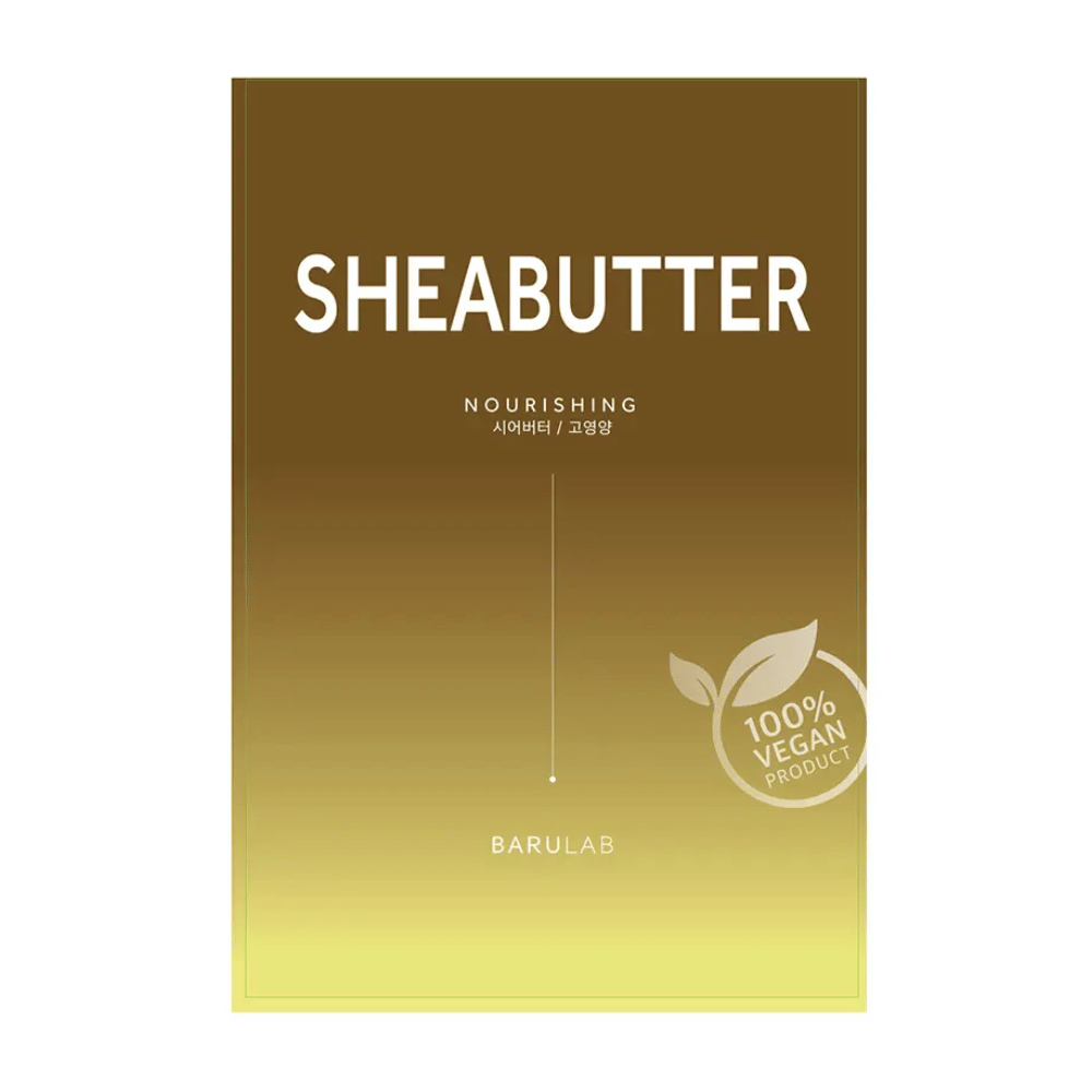 Een verpakking van BARULAB "SHEABUTTER Nourishing" masker, gemarkeerd als "100% Vegan Product". De verpakking heeft een kleurverloop dat van donker goudbruin bovenaan naar lichtgeel onderaan gaat.