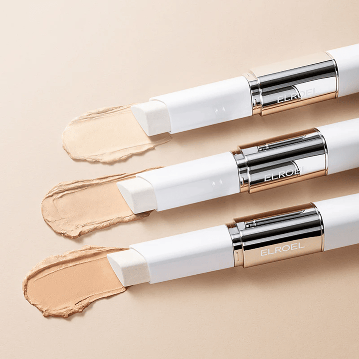 ELROEL Blanc Cover Cream Stick concealer met ingebouwde borstel, meerdere sticks uitgelijnd om het ontwerp en de applicatie van het product te tonen.