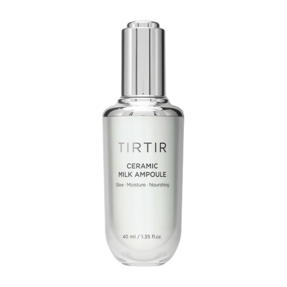  Een doorzichtige fles TIRTIR Ceramic Milk Ampoule, gemarkeerd met "Glow - Moisture - Nourishing", op een witte achtergrond.