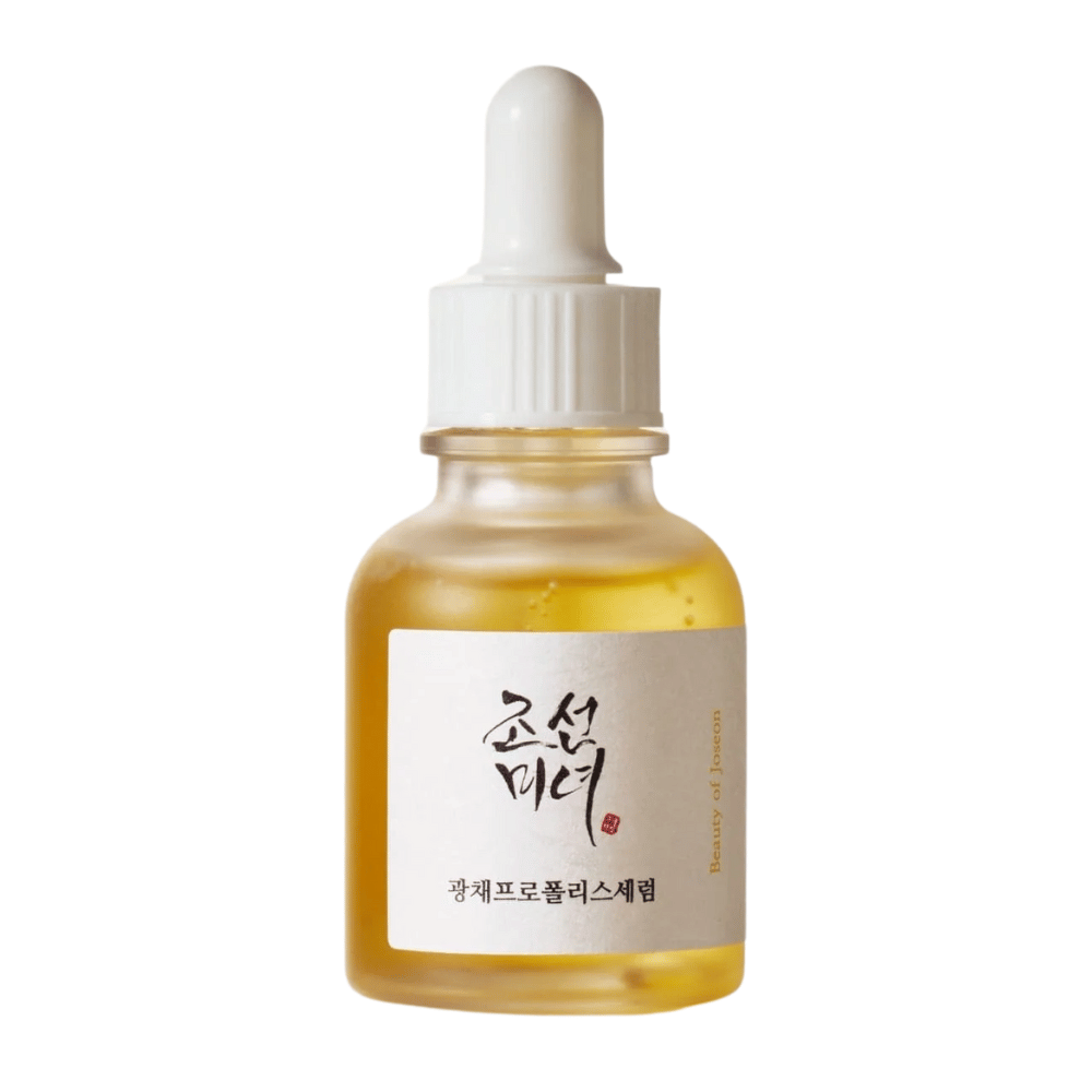 Fles van Beauty of Joseon Glow Serum met witte pipet en goudkleurig serum, een glansgevend product met propolis en niacinamide.