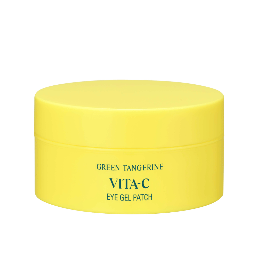 Een gele pot gemerkt "GREEN TANGERINE VITA-C EYE GEL PATCH" waarschijnlijk oogmaskers die vitamine C bevatten.