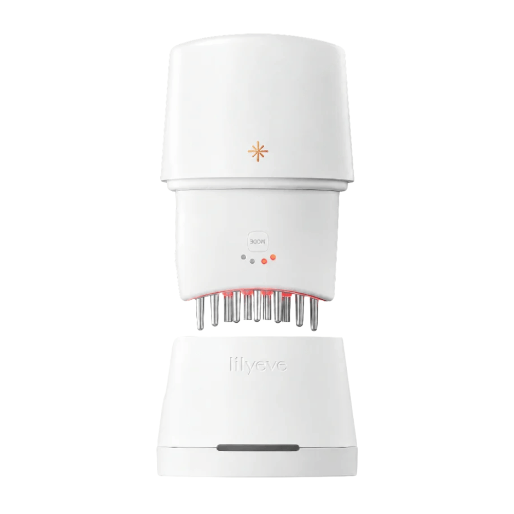 5. Lilyeve GrowTurn Pro – wit hoofdhuidapparaat met rood ledlicht en bijbehorend laadstation