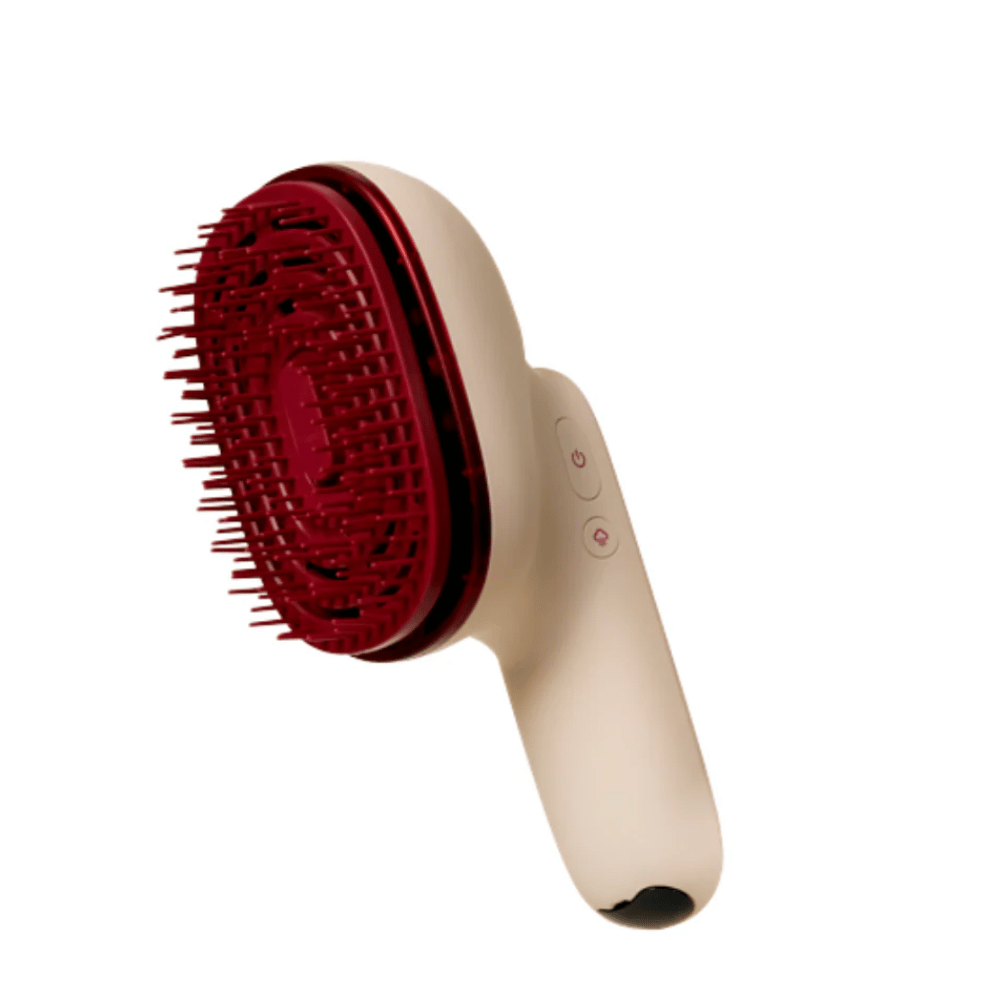 Close-up van MOEV Hair Steamer Pro met rode borstels en ergonomisch handvat. Professionele haarverzorgingsborstel met stoom en LED-technologie.