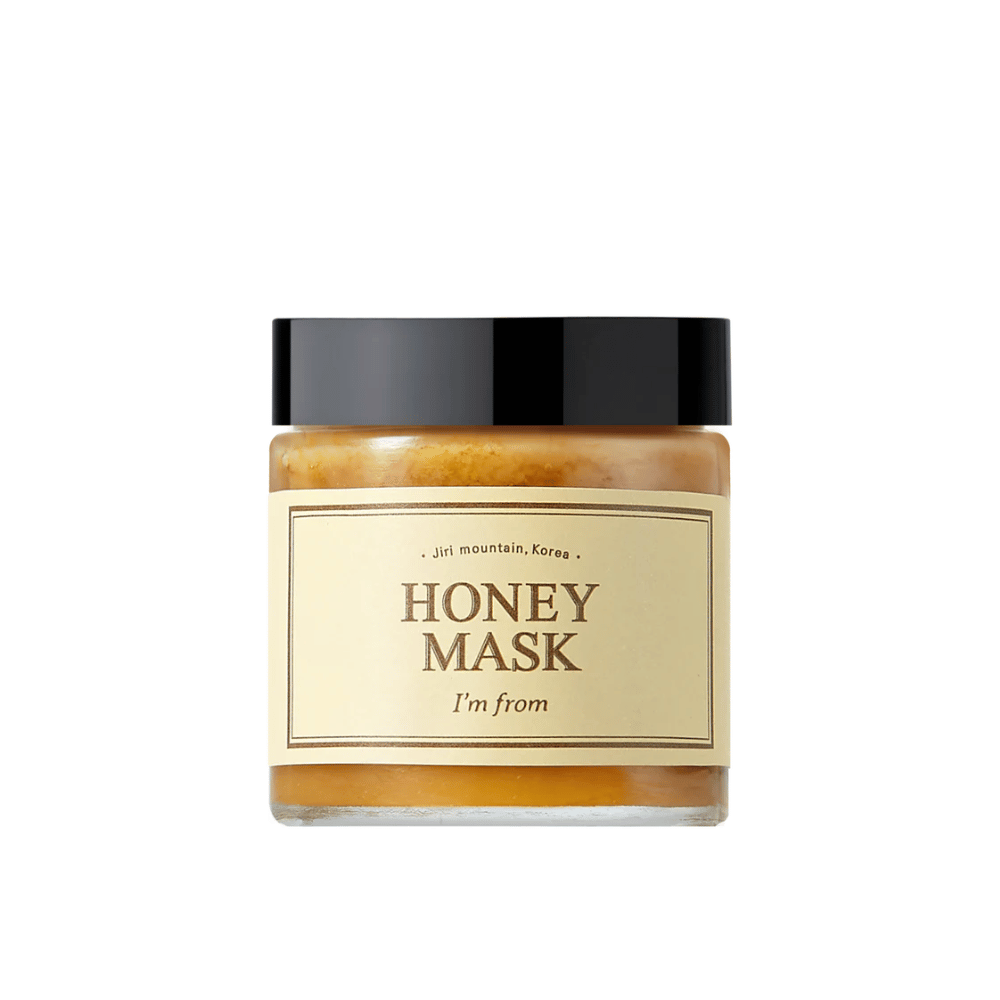  Een pot "I'm from Honey Mask", met natuurlijke honinginhoud, tegen een witte achtergrond.