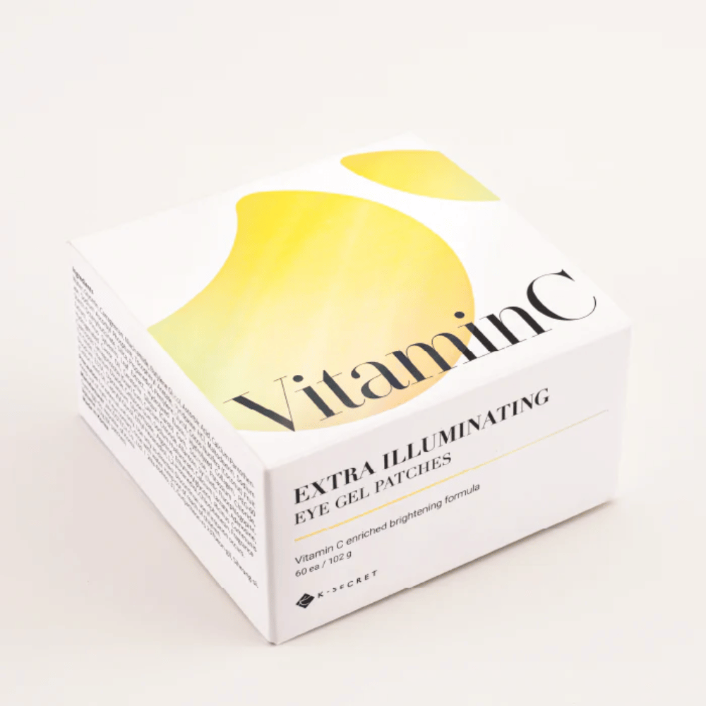 Verpakking van K-Secret Extra Illuminating Eye Gel Patches met vitamine C in wit en geel design.
