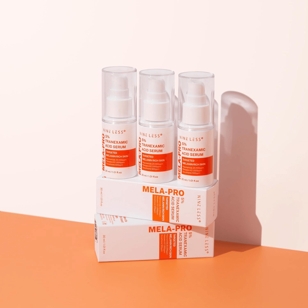 Drie NINE LESS MELA-PRO 5% Tranexamic Acid Serum 30 ml, verhelderend serum met niacinamide en glutathion voor melaninerijke huid.