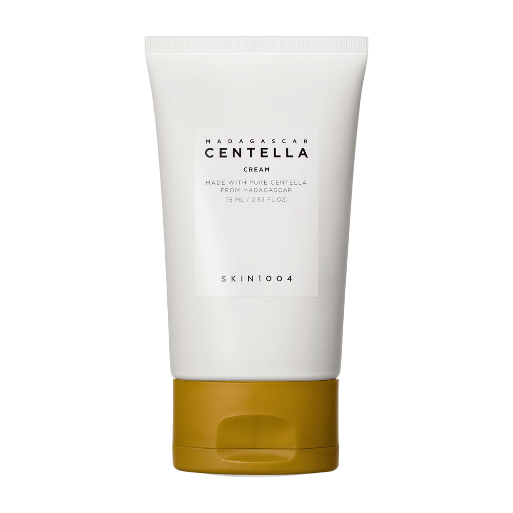 De afbeelding toont een tube met "Madagascar Centella Cream" van SKIN1004. Het is een huidcrème die is gemaakt van pure Centella uit Madagaskar en komt in een verpakking van 75 ml / 2.53 fl.oz. Het product is bedoeld voor huidverzorging, om de huid te voeden en te hydrateren.