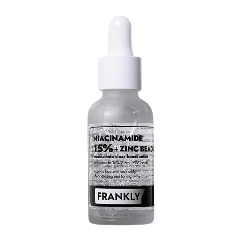 Productafbeelding van FRANKLY Niacinamide 15% + Zinc Beads Serum in glazen fles met pipet. Een serum dat de huid in balans brengt, kalmeert en de helderheid verbetert.