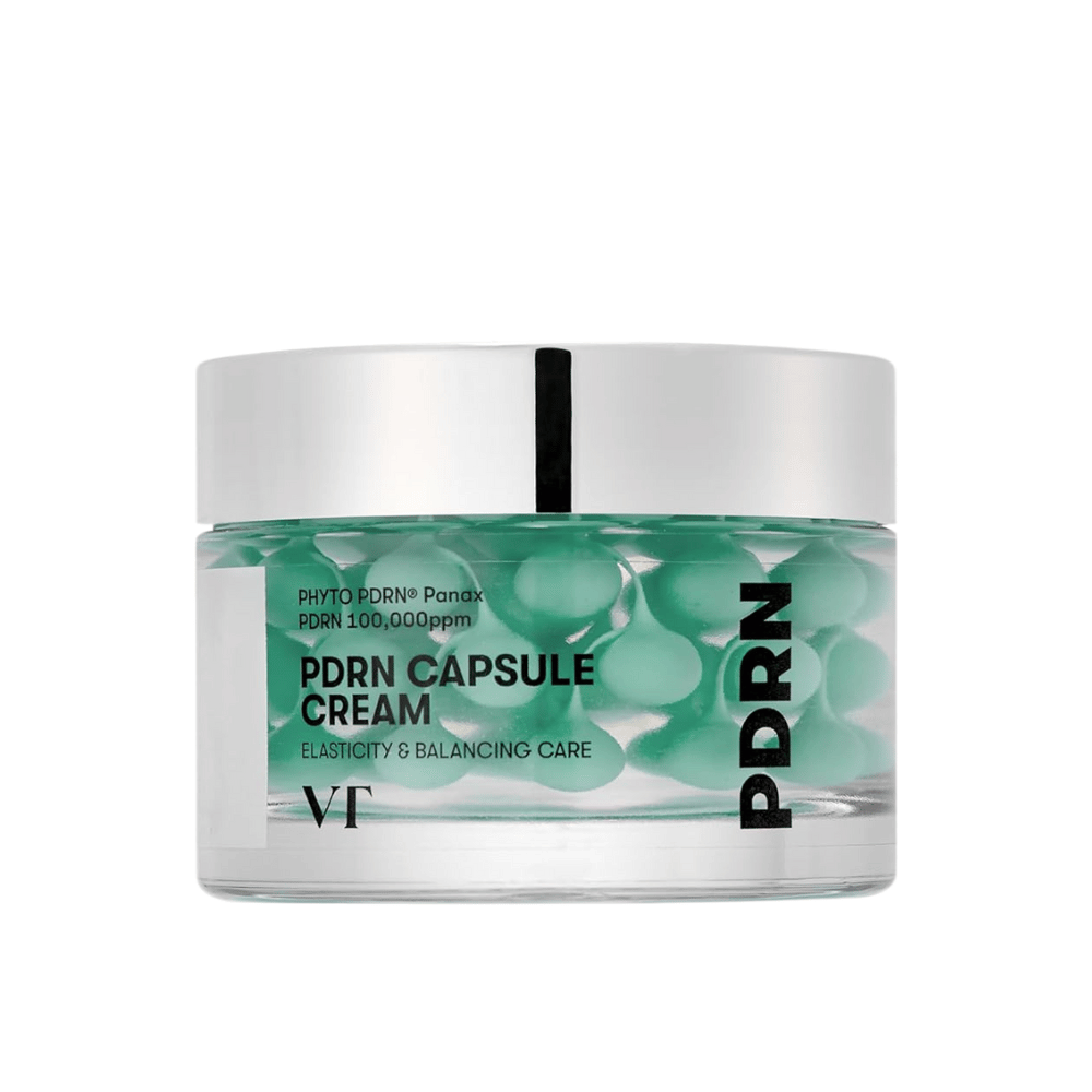 VT PDRN Capsule Cream in een transparante pot met zilveren deksel. De inhoud bestaat uit groene capsules in een heldere gel, en het etiket toont dat de crème bedoeld is voor elasticiteit en balancerende huidverzorging.