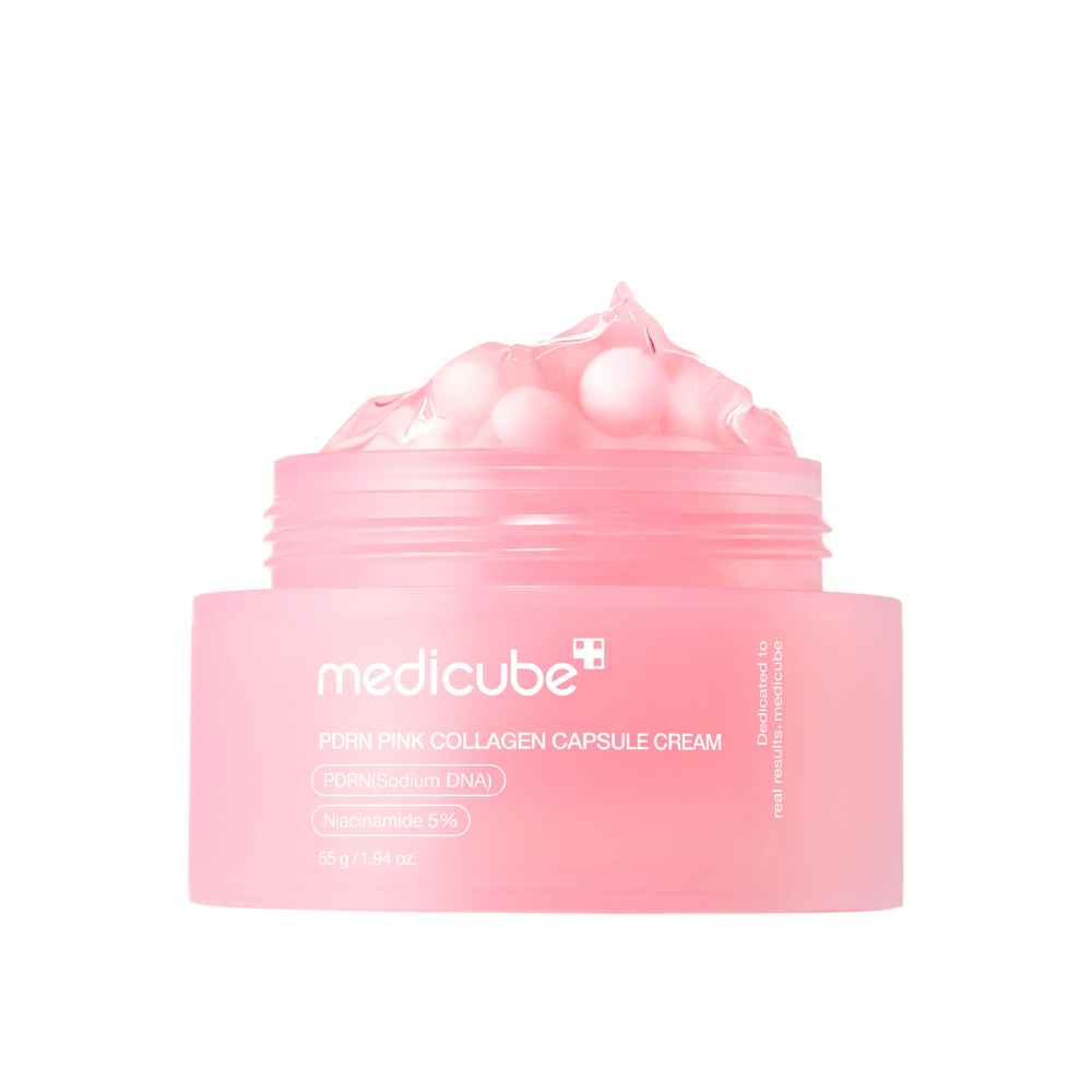Productafbeelding van Medicube PDRN Pink Collagen Capsule Cream met zichtbare roze capsules in een transparante roze pot, ontworpen om de huid te hydrateren en de teint egaal te maken.