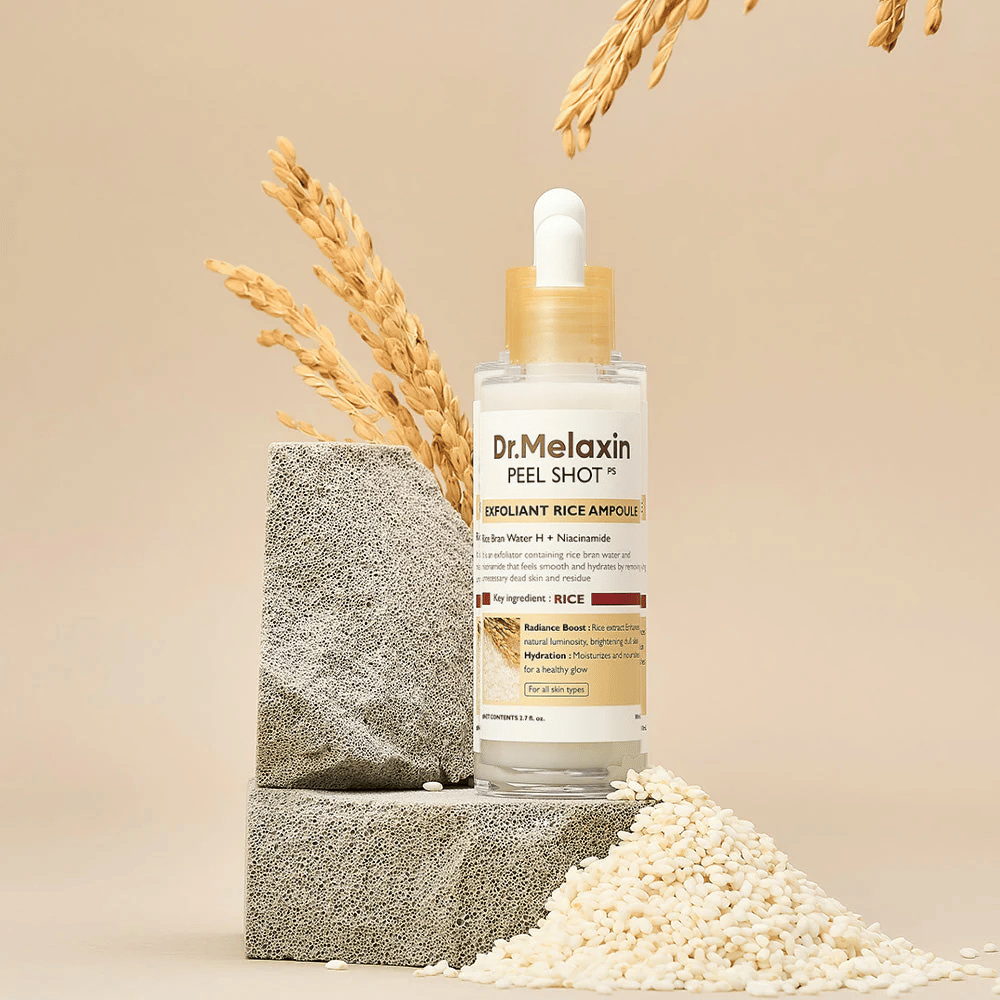 Dr.Melaxin Peel Shot Exfoliant Rice Ampoule opgesteld met rijst en stenen blokken, Koreaanse exfoliërende ampul met rijstextract en niacinamide voor helderdere en zachtere huid.