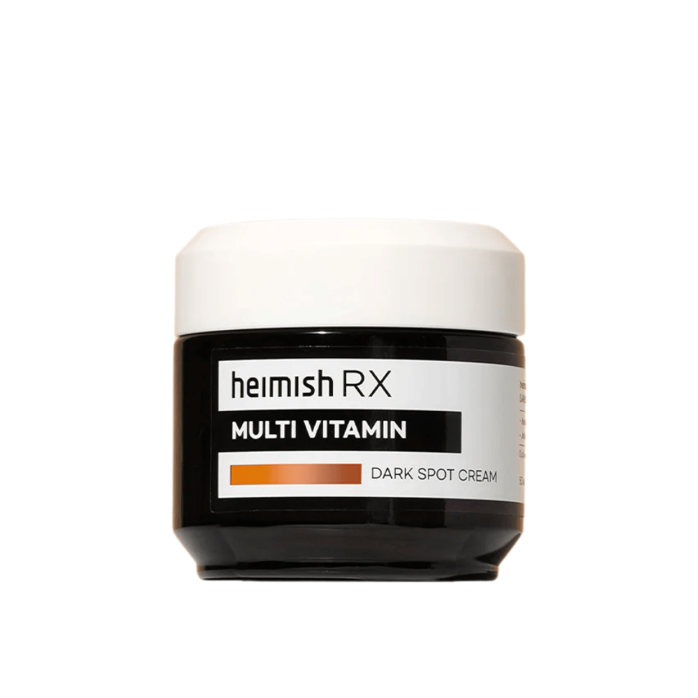 Heimish RX Multi Vitamin Dark Spot Cream in een strak zwart potje met een witte deksel. Een gezichtscrème verrijkt met multivitaminen, ontwikkeld om donkere vlekken te verminderen en de huidtint egaler te maken.