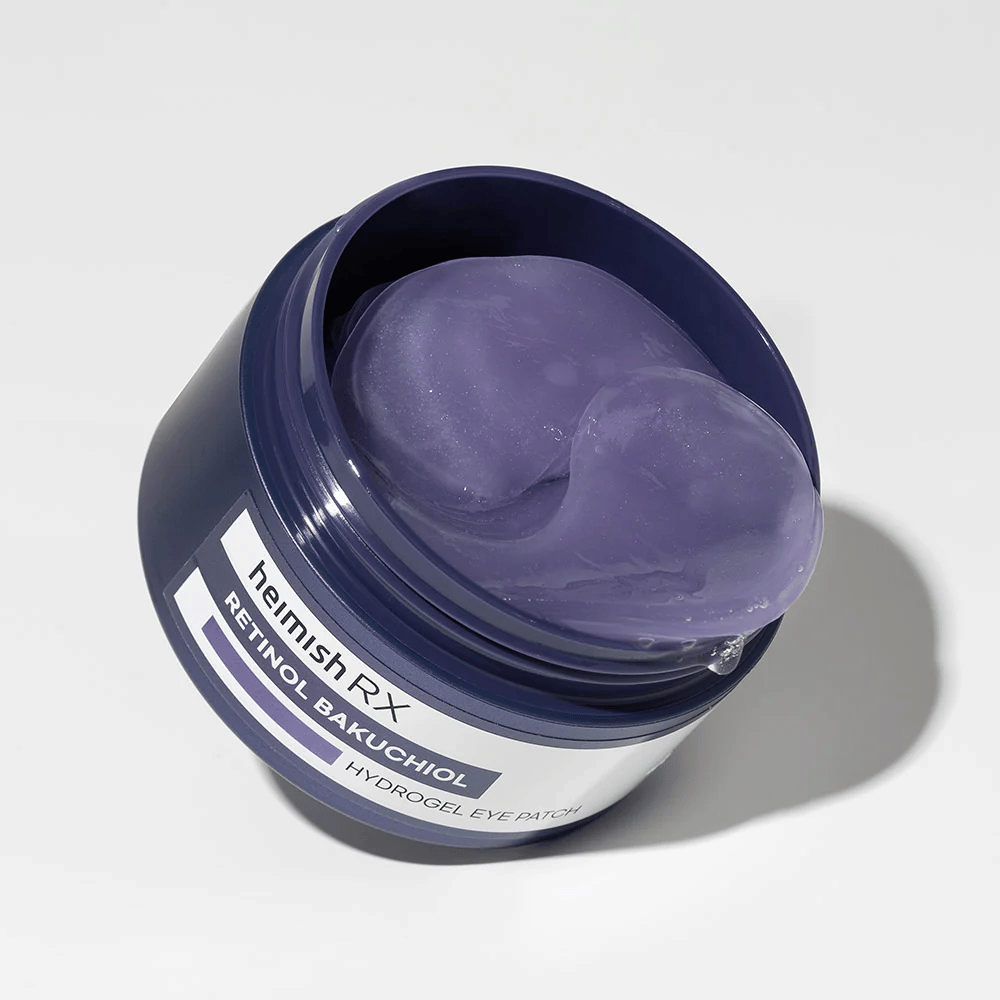 Heimish RX Retinol Bakuchiol Hydrogel Eye Patch in een donkerblauwe pot met paarse hydrogel-ooglapjes. Een product ontworpen om te hydrateren en fijne lijntjes rond de ogen te verminderen.
