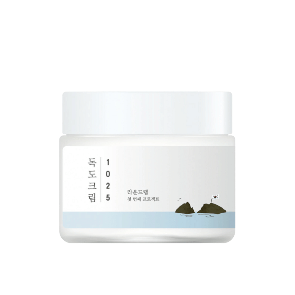 Een pot met Round Lab 1025 Dokdo Cream 80ml voor hydratatie op een witte achtergrond.