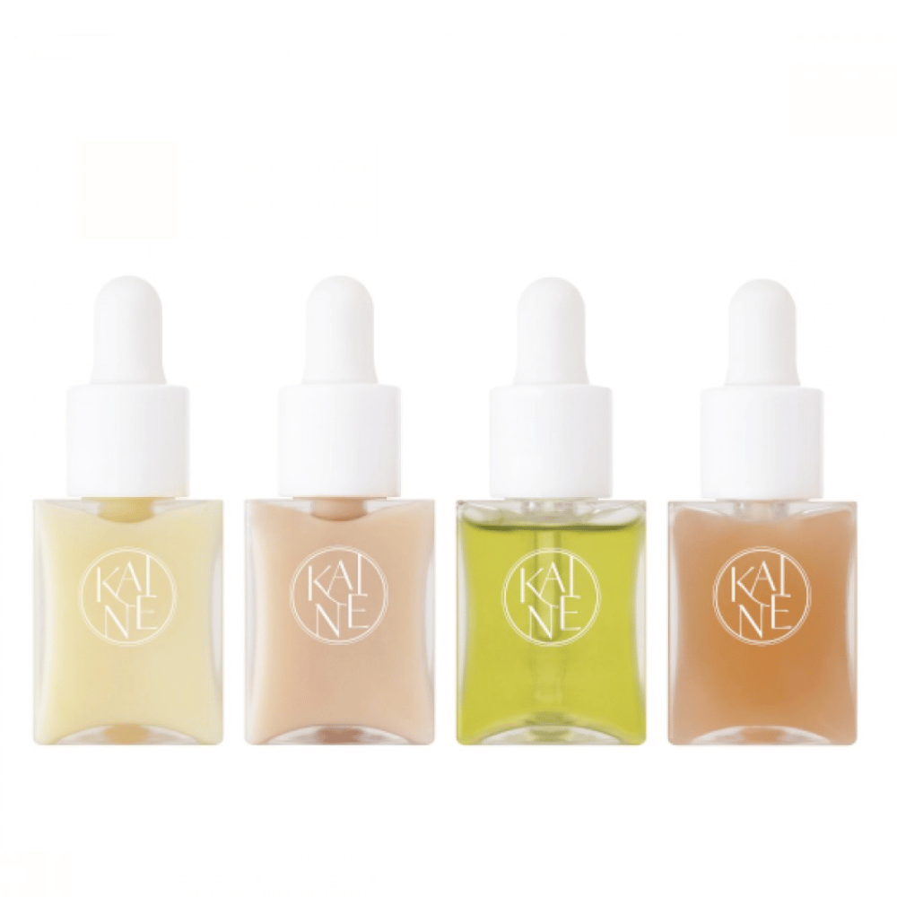 Vier kleurrijke serumflessen van KAINÉ Serum Discovery Kit met pipetdop, ontworpen om aan verschillende huidbehoeften te voldoen in een minimalistische en stijlvolle verpakking.