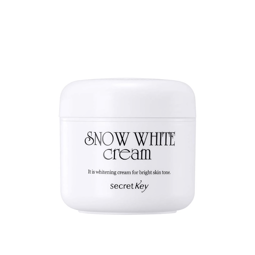 Productafbeelding van Secret Key Snow White Cream in een witte pot met zwarte tekst tegen een witte achtergrond.