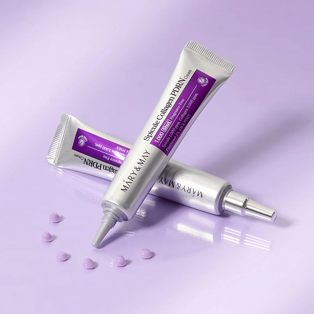 Mary & May Spicule Collagen PDRN Cream in meerdere tubes op paarse achtergrond, intensief herstellende gezichtscrème met spicula-technologie en collageen.