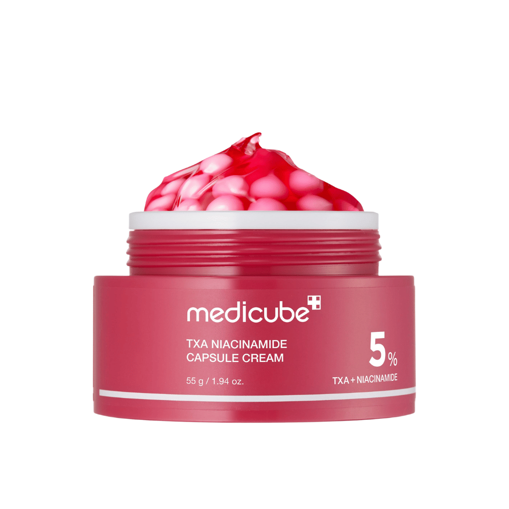 Medicube TXA Niacinamide Capsule Cream in een pot met roze capsules in gelvorm, duidelijk productmerk met 5% TXA + Niacinamide.