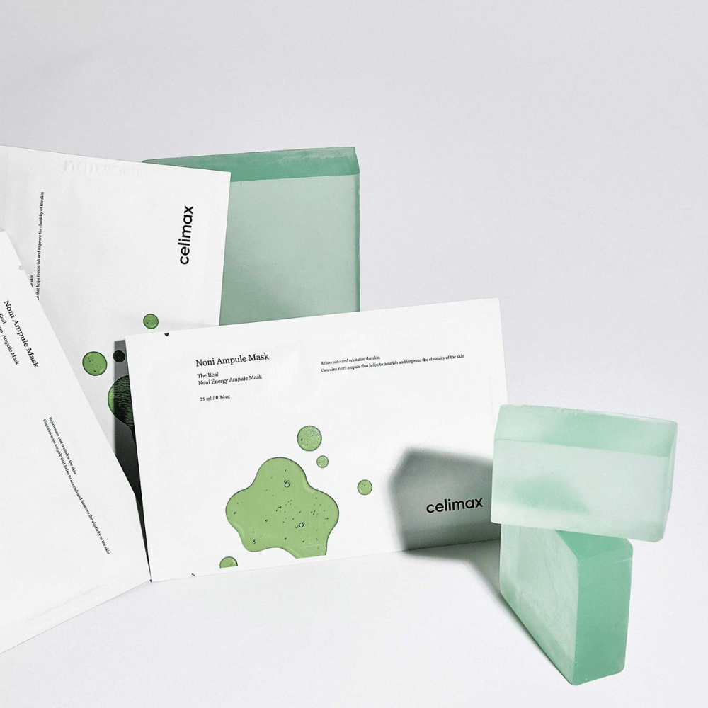 The Real Noni Energy Ampoule Mask van Celimax biedt een effectieve en hydraterende behandeling voor de huid. Met zijn unieke formule helpt het de structuur van de huid te verbeteren en glans te geven. De groene kleur van de maskers en het frisse ontwerp geven een gevoel van natuurlijkheid en reinheid.