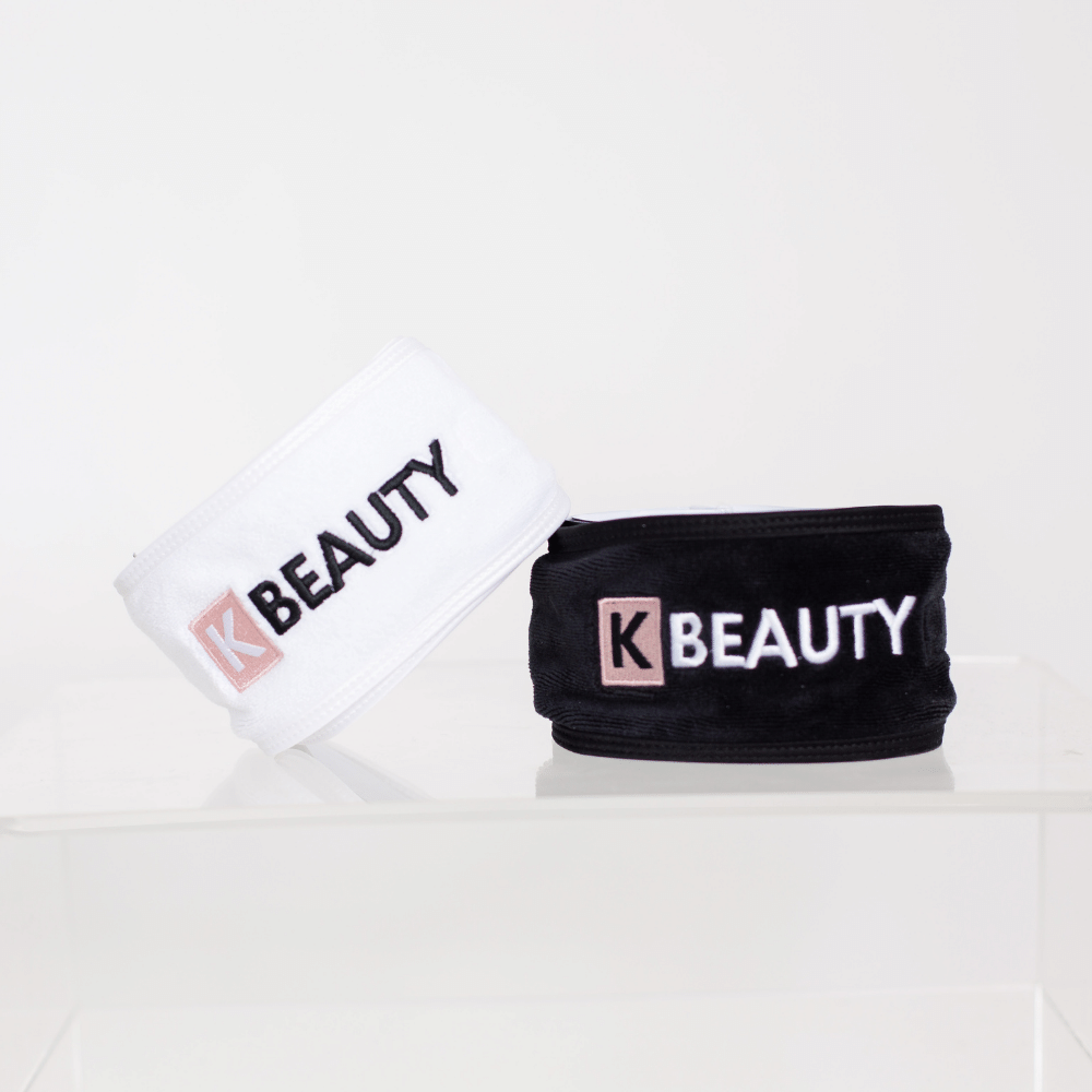 Twee K-Beauty Make-up Haarbanden met het woord "schoonheid" erop.